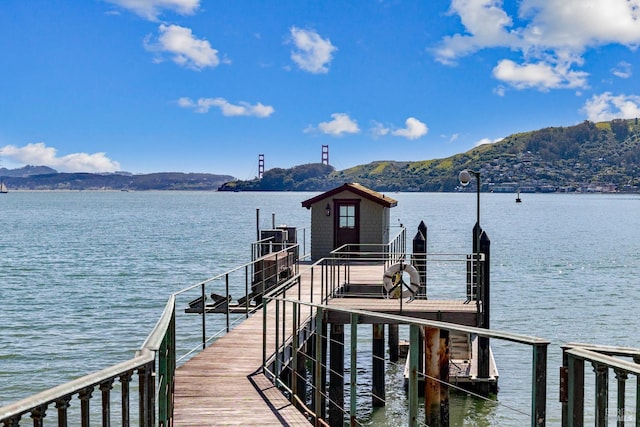 dock area featuring a water and mountain view