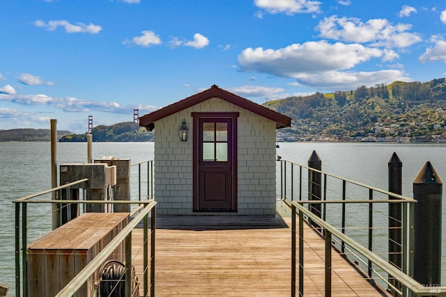 dock area with a water and mountain view