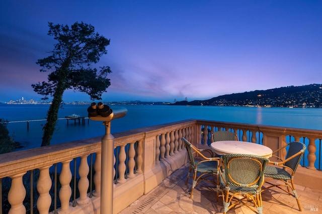 exterior space featuring outdoor dining space and a water view