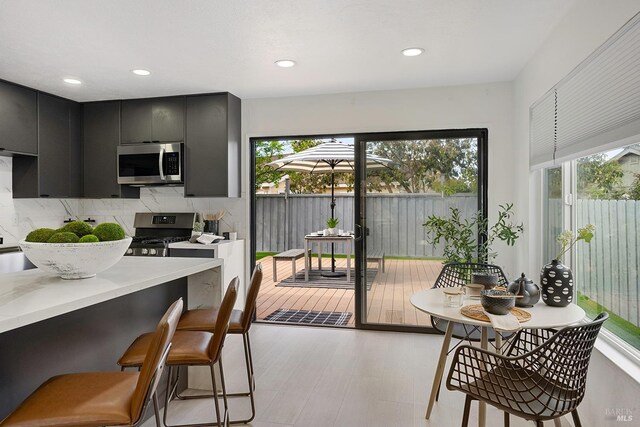 doorway to outside featuring recessed lighting