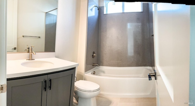 bathroom with washtub / shower combination, toilet, vanity, and tile patterned floors