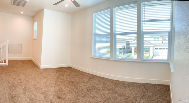 spare room with visible vents, baseboards, ceiling fan, recessed lighting, and light carpet