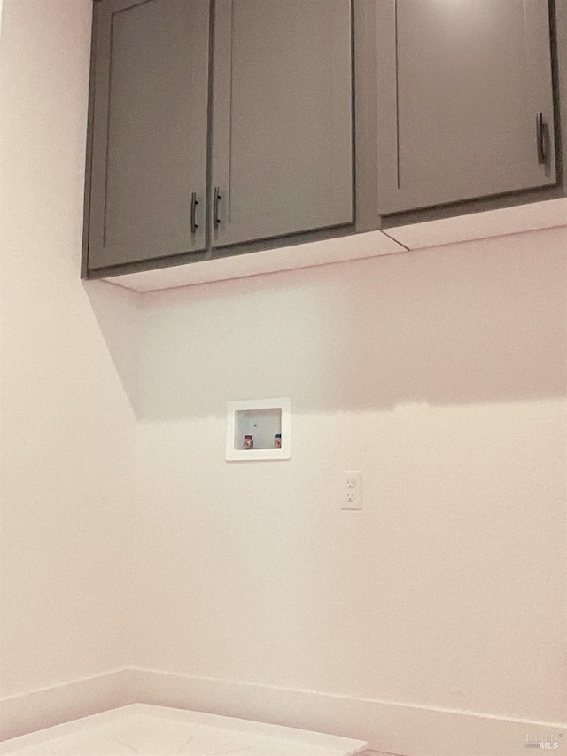 laundry area featuring cabinet space and washer hookup