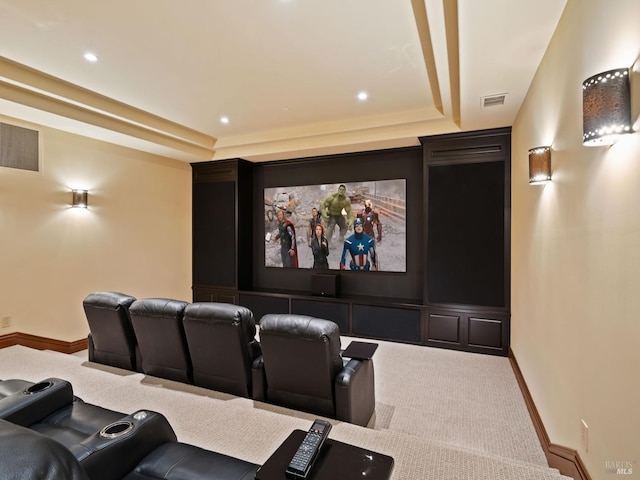 carpeted home theater room with visible vents, baseboards, a raised ceiling, and recessed lighting