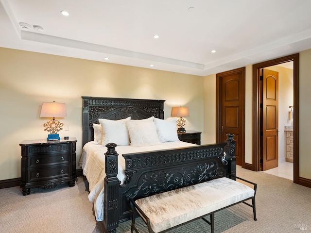 carpeted bedroom with recessed lighting, baseboards, and a raised ceiling