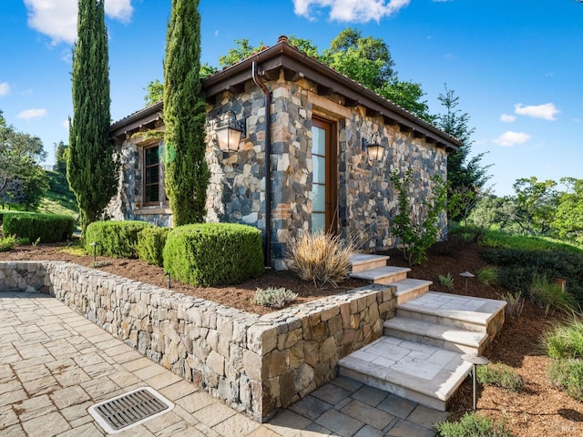 view of home's exterior with stone siding