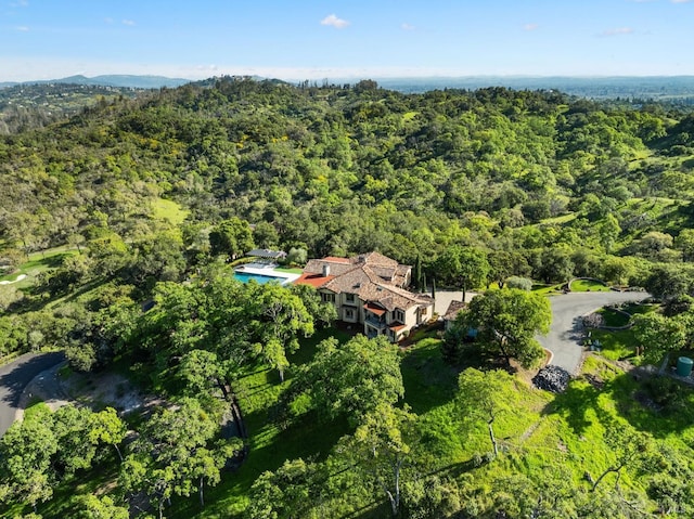aerial view with a wooded view