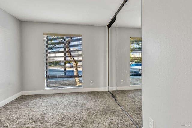 900 Southampton Rd Unit 99, Benicia, CA 94510 - unfurnished room with baseboards and carpet flooring