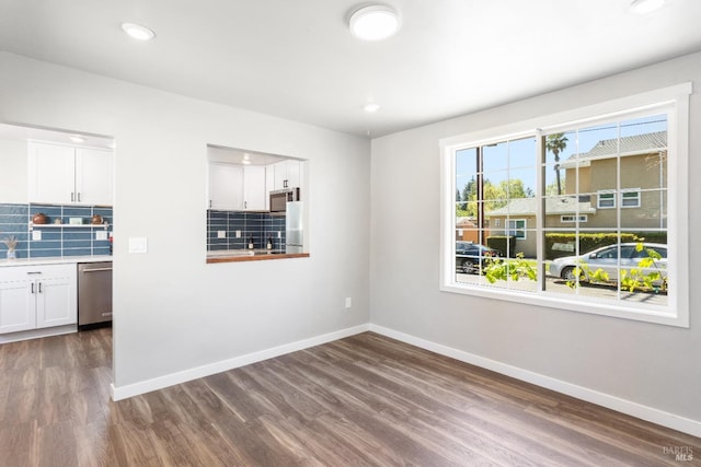 16 Adeline Way, Healdsburg, CA 95448 - interior space featuring dark wood-style floors, baseboards, backsplash, and appliances with stainless steel finishes