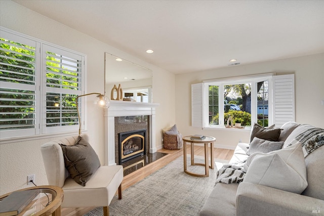 1811 Pacifica Ct, Benicia, CA 94510 - living area with recessed lighting, a tile fireplace, visible vents, and wood finished floors