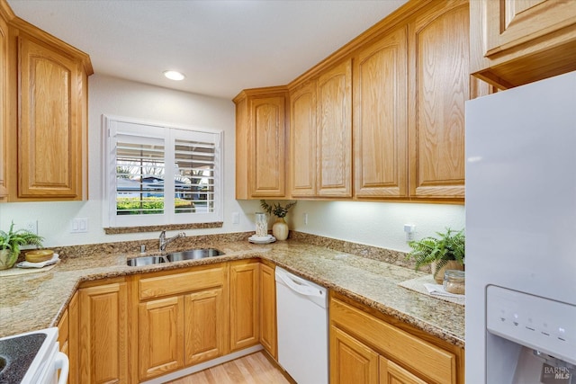 1811 Pacifica Ct, Benicia, CA 94510 - kitchen with a sink, white appliances, light wood-style floors, recessed lighting, and light stone countertops