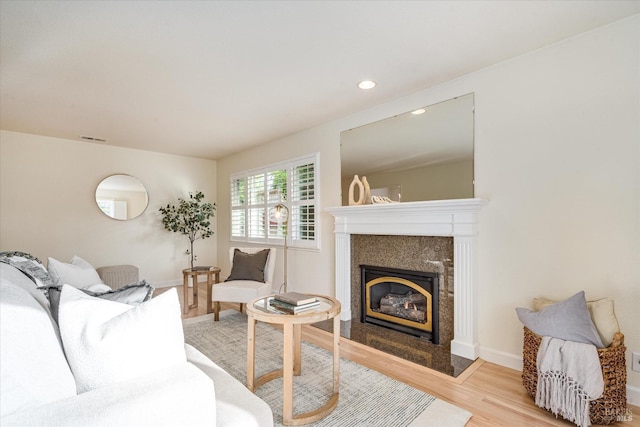 1811 Pacifica Ct, Benicia, CA 94510 - living area featuring baseboards, wood finished floors, a fireplace, and visible vents