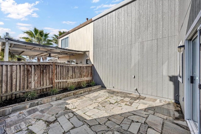 view of patio / terrace featuring fence