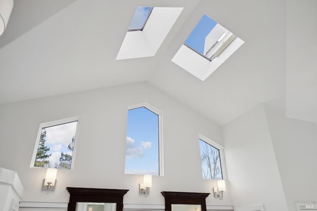 additional living space featuring vaulted ceiling with skylight
