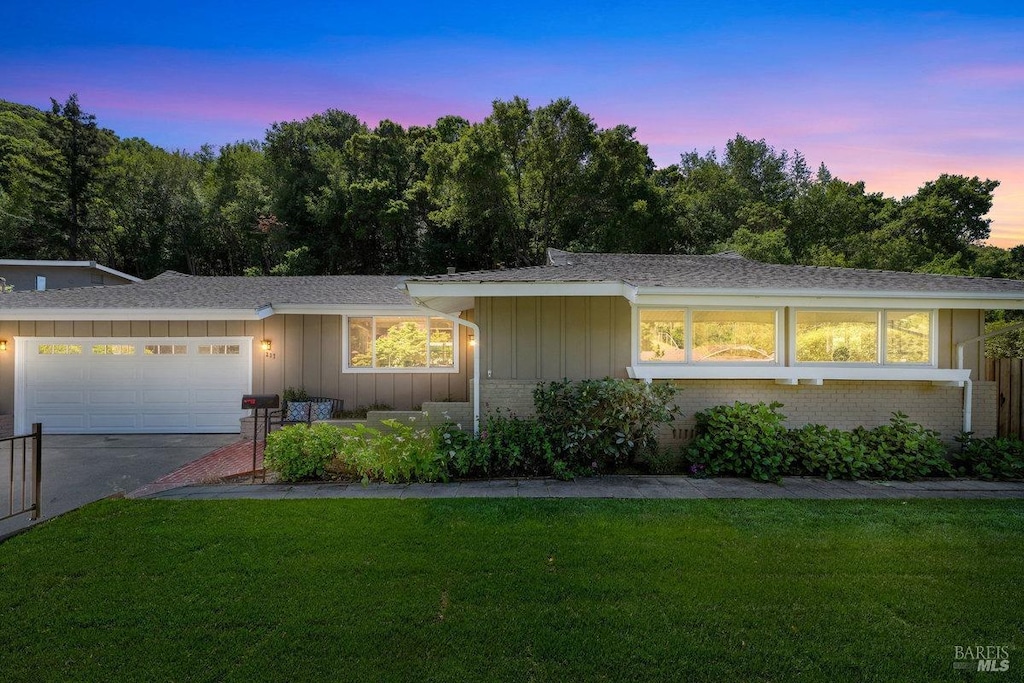 237 Elvia Ct, San Rafael, CA 94903 - single story home featuring an attached garage, board and batten siding, a yard, driveway, and brick siding