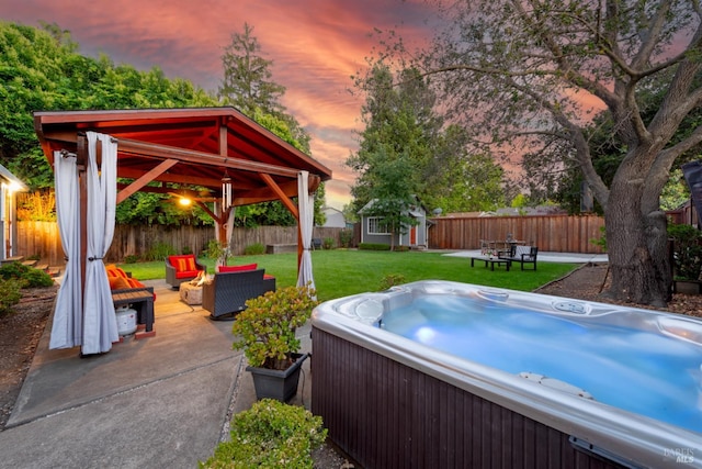1595 Cinnamond St, Napa, CA 94559 - patio terrace at dusk with a gazebo, a hot tub, a fenced backyard, an outdoor structure, and an outdoor living space