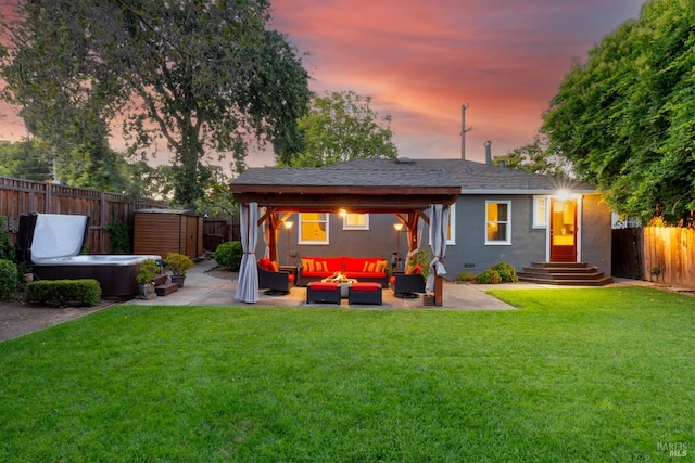 1595 Cinnamond St, Napa, CA 94559 - back of property at dusk with outdoor lounge area, a fenced backyard, a patio, a hot tub, and stucco siding