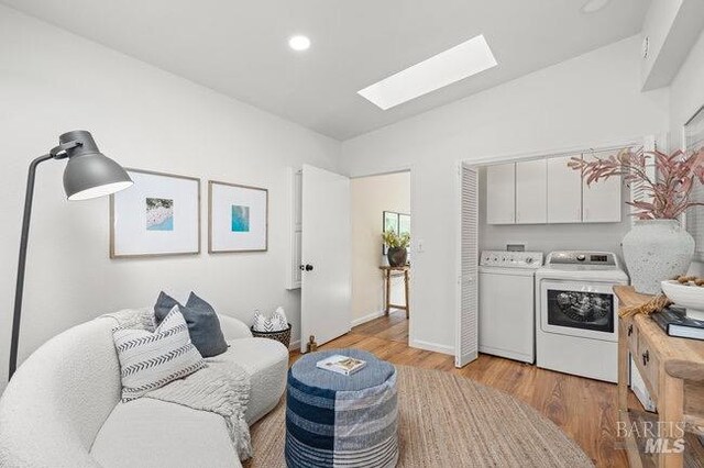294 Scenic Rd, Fairfax, CA 94930 - sitting room with a skylight, washer and dryer, light wood-type flooring, recessed lighting, and baseboards