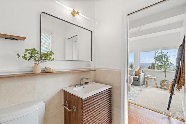 294 Scenic Rd, Fairfax, CA 94930 - bathroom with vanity, toilet, tile walls, and a wainscoted wall