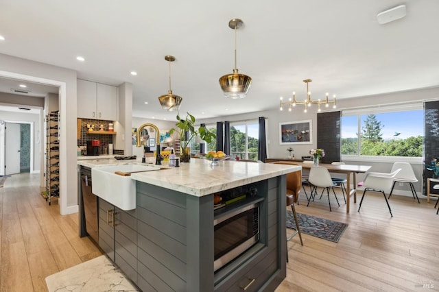 299 Via Barranca, Greenbrae, CA 94904 - kitchen with stainless steel microwave, recessed lighting, light wood-style floors, and black dishwasher