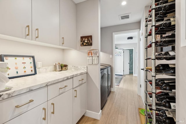 299 Via Barranca, Greenbrae, CA 94904 - interior space with light wood-style floors, visible vents, baseboards, and washing machine and dryer
