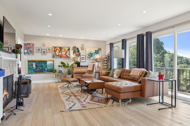 299 Via Barranca, Greenbrae, CA 94904 - living room featuring baseboards, a stone fireplace, recessed lighting, visible vents, and hardwood / wood-style floors