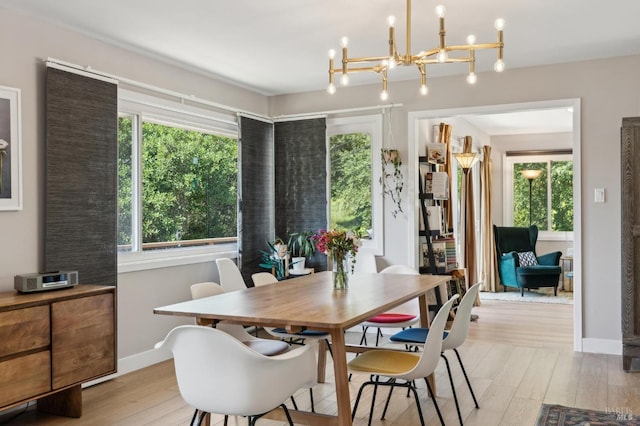 299 Via Barranca, Greenbrae, CA 94904 - dining area with baseboards, light wood-type flooring, and an inviting chandelier