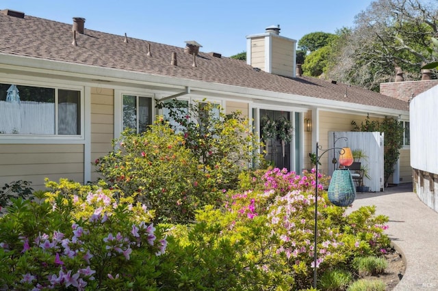 299 Via Barranca, Greenbrae, CA 94904 - rear view of property with roof with shingles and a chimney