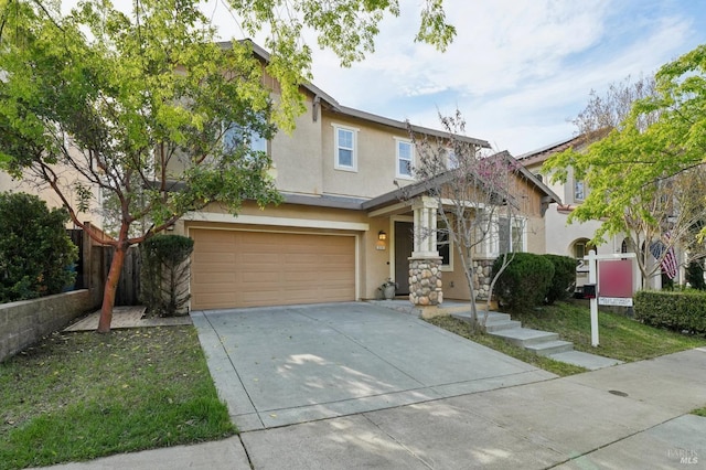 view of front of home featuring fence, stucco siding, a garage, and concrete driveway