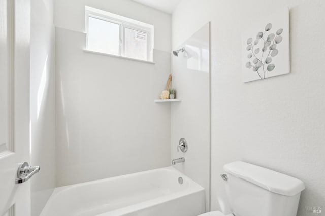 bathroom featuring toilet and tub / shower combination