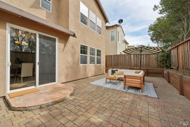 view of patio / terrace featuring an outdoor living space and a fenced backyard