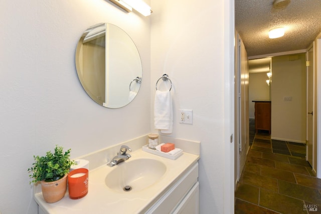 bathroom featuring vanity and a textured ceiling