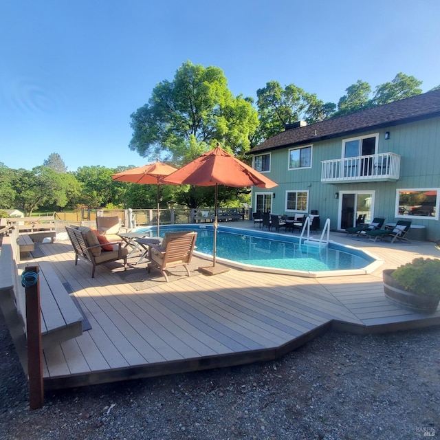 view of swimming pool featuring a fenced in pool
