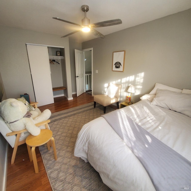 bedroom with a closet, a ceiling fan, and wood finished floors