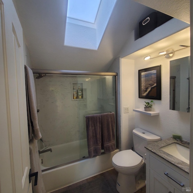 bathroom featuring lofted ceiling with skylight, toilet, wood finished floors, combined bath / shower with glass door, and vanity
