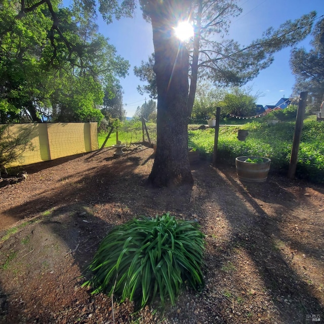 view of yard featuring fence
