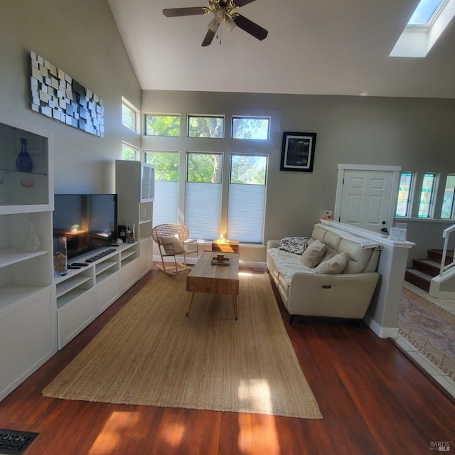 living room with ceiling fan, visible vents, vaulted ceiling, and dark wood finished floors