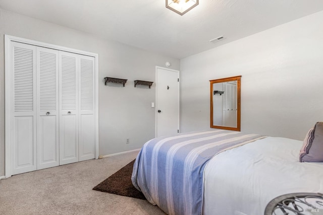 bedroom featuring visible vents, baseboards, and carpet
