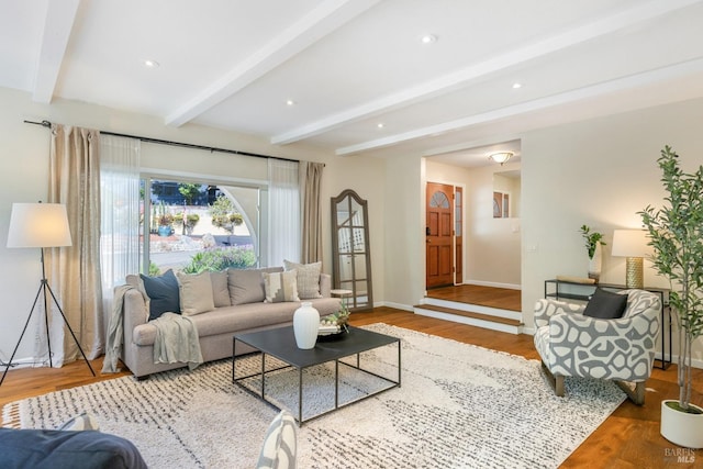 living room featuring beamed ceiling, baseboards, recessed lighting, and wood finished floors