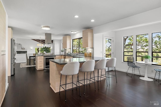 2532 Laguna Vista Dr, Novato, CA 94945 - kitchen featuring appliances with stainless steel finishes, island exhaust hood, a peninsula, a sink, and light brown cabinetry