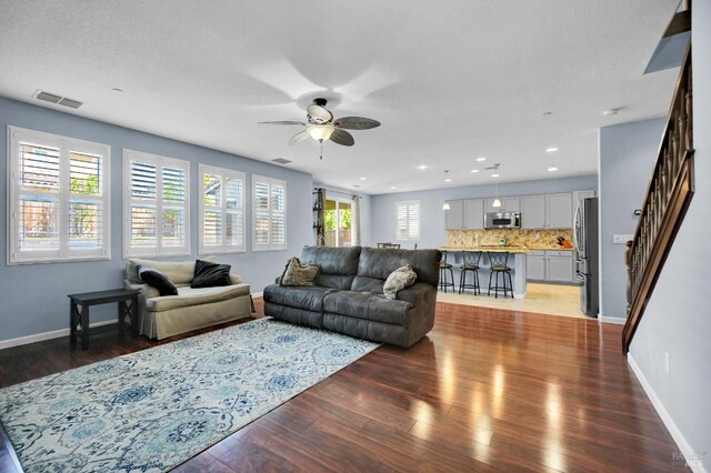 2436 Chuck Hammond Dr, Fairfield, CA 94533 - living room featuring ceiling fan, visible vents, recessed lighting, light wood finished floors, and baseboards