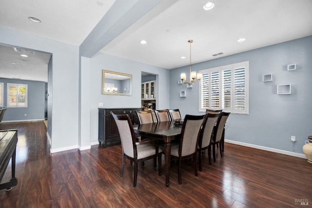 2436 Chuck Hammond Dr, Fairfield, CA 94533 - dining area with a notable chandelier, dark wood-type flooring, visible vents, and baseboards