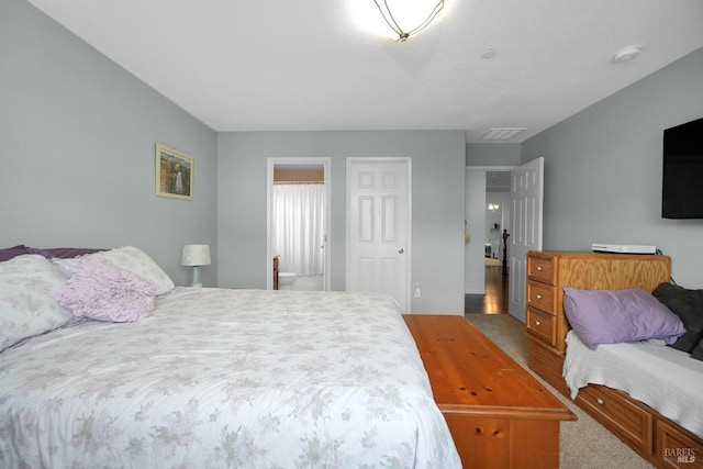 2436 Chuck Hammond Dr, Fairfield, CA 94533 - bedroom featuring visible vents, carpet, and connected bathroom