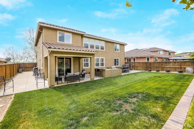 2436 Chuck Hammond Dr, Fairfield, CA 94533 - rear view of house with outdoor lounge area, stucco siding, a fenced backyard, a tile roof, and a lawn