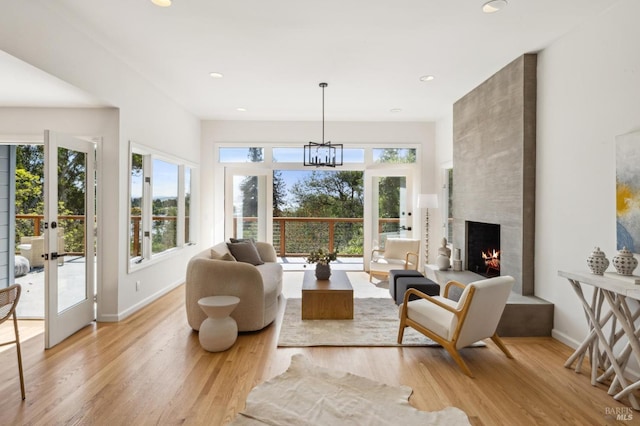 interior space featuring plenty of natural light, a notable chandelier, and french doors