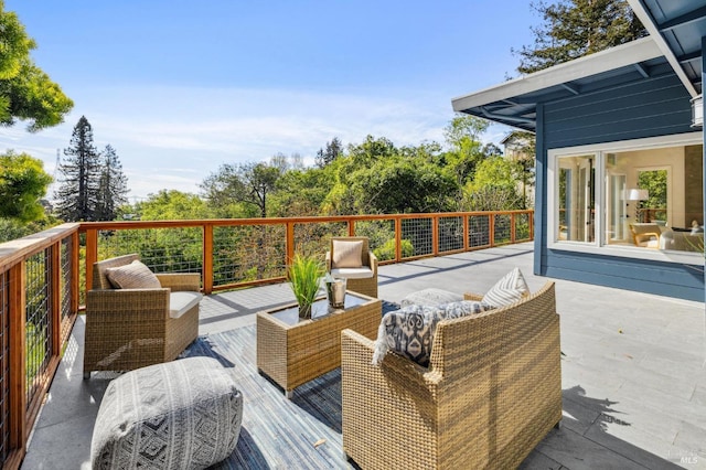 wooden deck with an outdoor living space