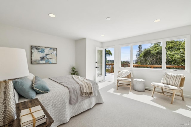 bedroom with recessed lighting, access to exterior, and carpet flooring