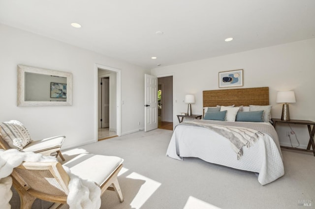 bedroom with baseboards, light carpet, and recessed lighting