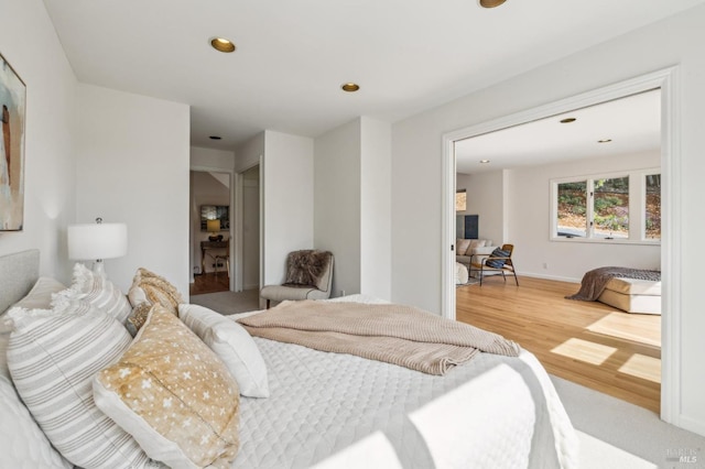 bedroom featuring recessed lighting and wood finished floors