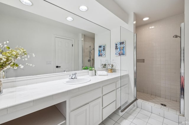 full bath with tile patterned flooring, recessed lighting, vanity, and a stall shower